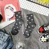 Calcetines de lunares dulces nuevos de otoño e invierno calcetines de lunares para niños estilo académico caricatura japonesa y coreana fabricantes de Liaoyuan al por mayor