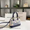 Bolsa de Concha Bordada Pesada Estilo Chino Dropshipping Nuevo Modelo Primavera/Verano Bolso de Mano de Oficina de Gama Alta