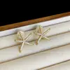 Pinza para Oreja de Espiral para Mosquitos Estrella de Mar de Zirconio Completo Sin Perforaciones para Mujer, Pendientes Simples, Frescos y de Moda, Pendientes de Lujo Accesible y Exquisitos