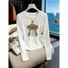 Elegante camiseta de manga larga ajustada para mujer, nuevo modelo otoño 2026, simple y chic, versátil, color albaricoque, top de algodón puro
