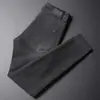 Calça jeans outono masculina de alta qualidade francesa, preta e cinza, corte slim, perna afunilada, stretch, versátil, nova calça longa casual 2026