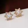 Pendientes de estrella hexagonal de cobre europeos y americanos transfronterizos joyería geométrica incrustados con diamantes nicho simples pendientes de temperamento de chica en stock
