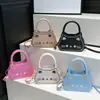 2026 Verano Nuevo Elegante Lindo Gato Dibujos Animados Femenino Simple Versátil Moderno Bolso de Hombro Cruzado Bolso de Mano