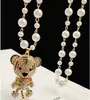 Collar de Perlas de Camelia que Gotea Aceite Nueva Moda para Mujer Exquisita Cadena Larga para Suéter Colgante Versátil de Ropa de Alta Gama