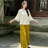 Conjunto de top de seda de estilo chino otoñal, con reducción de edad y calidad garantizada, con tapeta diagonal y detalles de botones, combinado con pantalones de pierna ancha para mujeres de mediana edad