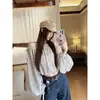 Top de lunares de un hombro estilo francés Ruoxin, nueva colección de primavera para mujer, blusa corta de manga larga