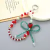 Cadena para Teléfono Móvil Llavero Colgante Pequeño Fresa de Cristal con Lazo Pulsera de Cuentas Colgante de Muñeca Moda para Mujer