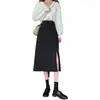 Falda midi para mujer, nueva colección de primavera 2026, con un elegante diseño francés, cintura alta, abertura y una silueta A negra que acentúa las caderas.