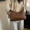 Bolsa de ombro underarm da moda para mulheres, novo estilo 2026, com um toque de luxo, apresentando um design de desenho animado, estilo retrô e adequada para o outono.