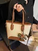 Bolso de mano tipo cubo nuevo de primavera 2026, transfronterizo, estilo vintage simple, de alta gama, moderno, para ir al trabajo, bolso de hombro cruzado de moda