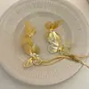Pendientes con borlas de flores doradas para mujer, ligeros, lujosos, de alta gama, 2024, nuevos, explosivos, exagerados, únicos y elegantes.