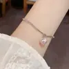 Pulsera de moda elegante estilo coreano, simple, con costura de punto de diamante y perla, para mujer, personalidad, lujo ligero, de alta gama, versátil, pulsera al por mayor