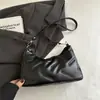 Moda de Primavera Nueva 2025 Bolso de Gran Capacidad para Mujer Tela de Plumón Color Sólido Estilo Simple y Occidental Bolso de Hombro Único