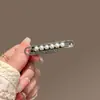 Horquilla de perla elegante para mujer, con lazo negro, de metal, con clip lateral avanzado, para flequillo, con clip de pico de pato simple