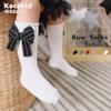 Calcetines de otoño e invierno para niños con lazo de color sólido rojo año nuevo calcetines de tubo calcetines de algodón de viento de princesa para niñas calcetines de baile al por mayor