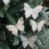 Paquete de 3 decoraciones de mariposas de plumas, con clips de mariposa realistas y tridimensionales, con brillo dorado reluciente, perfectas para decoraciones de Navidad