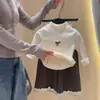 Top térmico de cuello alto con forro polar para otoño e invierno, ropa elegante y versátil de manga larga con pajarita para niñas, ropa infantil al por mayor