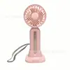 27 anos Novo ventilador de mão pequeno Carregamento USB Vento forte de três velocidades Longa duração da bateria Cordão base destacável Portátil de mesa