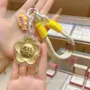Llavero Colgante para Teléfono Móvil de Oro Flor de Oro Puro 999 Rica en Oro Personalizado con Fotos como Recuerdos y Pequeños Regalos