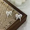 Brincos de Laço Pérola com Fita Estilo Resort Francês para Mulheres Agulha de Prata S925 Brincos Versáteis Doces e Modernos para o Dia a Dia
