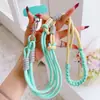 Venta al por mayor del fabricante Nuevo estilo coreano Lanyard de color para teléfono móvil Cuerda larga Correa diagonal para niñas Cuerda Anti-pérdida Nudo plano fuerte Tejido
