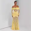 Nuevo estilo transfronterizo europeo y americano: un sexy vestido de noche de sirena con diseño de un solo hombro, mangas largas y una silueta ajustada con intrincados detalles de encaje