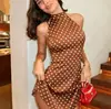Vestido de Verano 2026 Europeo y Americano de Lunares con Cuello Halter Espalda Descubierta Cintura Ceñida Línea A Corto Vestido Ropa para Mujer de Vacaciones Transfronteriza de Amazon