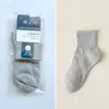 Calcetines de empaque individual para hombre, calcetines de algodón para hombre de color liso para otoño e invierno, calcetines para hombre al por mayor, calcetines deportivos de tubo largo para hombre