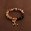 Pulsera bicolor de cristal azul natural y cristal rosa con diseño de oso y rosa, una pulsera blanca de lujo ligero y estilo antiguo fresco.