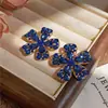 Aretes de plata con pasador, con diamantes y diseño de flor de gota de agua, moda de nicho de alta gama, aretes simples y versátiles, elegantes y con estilo para mujer