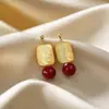 Aretes Geométricos Rojos Ankela Festivos de Año Nuevo Nicho Temperamento Venta Caliente Aretes de Botón Otoño/Invierno 2026 Venta al por Mayor de Pendientes