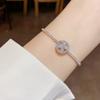 Pulsera ajustable de trébol de cuatro hojas giratorio de circón con sentido del diseño nicho, moda, personalidad, temperamento, joyería de lujo ligero al por mayor