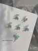Nuevos Rhinestones para Uñas Qiansi Mengdie Zirconio Acabados 3D Doble Capa Ala Fina Ala de Mariposa Decoración de Rhinestone para Uñas Venta al por Mayor