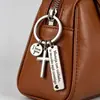 Amazon Transfronterizo Simple Acero Inoxidable Grabado Cruz Llavero de Moda Creativo Versátil Colgante para Bolsa Regalo