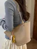 Bolso de cubo de nicho transfronterizo para mujer, nuevo bolso de mano versátil de moda 2026 con patrón de lichi, bolso de hombro cruzado