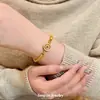 Nuevo Pulsera Brújula de Loto Chapada en Oro Estilo Chino con Diseño Giratorio para Mujer, Presentando un Nicho, Lujo Ligero y Sensación de Alta Gama