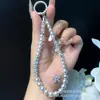 Exquisita y de Alta Gama Cadena para Teléfono Móvil Perla Dahua Pedrería Temperamento Cadena para Colgar en la Muñeca Cadena de Perlas Nicho Colgante Venta al por Mayor