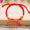 Pulsera de Cuerda Roja con Nudo de Flor de Datura Dorada Tejida a Mano Dos en Uno para Pareja, Amuleto de la Suerte, Joyería de Cuerda Roja de Mano