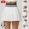 Nueva falda plisada de tenis de cintura alta para otoño e invierno para mujer, minifalda deportiva de bádminton con bolsillos, falda falsa de dos piezas anti-exposición