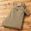 Estilo popular continúa otoño e invierno nueva textura sarga elástica pantalones largos de negocios de alta gama rectos versátiles pantalones casuales para hombre