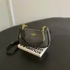 Bolso de axila de nicho para mujer, nuevo y moderno 2026, bolso de hombro súper popular de otoño vintage, bolso cruzado de alta gama para el día a día