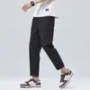 Pantalones casuales para hombre, pantalones cropped modernos estilo coreano para jóvenes, pantalones finos de seda helada elástica de cintura media para verano