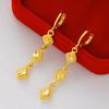 Pendientes de corazón chapados en oro de imitación de latón, venta al por mayor, para mujer, con forma de corazón de melocotón, joyería con temperamento de oro arena de Vietnam.