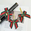 Decoraciones de lazo de campana de Navidad Colgante de regalo de Navidad Embalaje Cinta de tela roja y verde Accesorios para árbol de Navidad