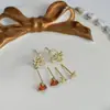 Una tarjeta tres pares de pendientes de combinación de moda lazo simple micro incrustado circonita pasador S925 pendientes al por mayor
