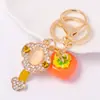 Trae Riqueza y Tesoro, Llavero Anillo de Cristal Shishi Ruyi, Regalo Pequeño, Fruta Caqui, Venta al por Mayor de Pequeños Artículos de Yiwu