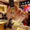 Colgante de Riqueza Instantánea Beige Dorado Oro Llavero para Teléfono Oro Puro Colgante para Bolso Joyería Tienda de Oro Regalo en Vivo