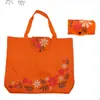 Fábrica para bolsa de mano impermeable de tela Oxford para regalos, bolsa de compras plegable de moda colorida con flores, bolsa de almacenamiento de protección ambiental portátil