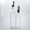 Fabricantes de botellas de vidrio suministran botella transparente para aceite de oliva empaque sellado botella marrón para aceite de sésamo botella verde oscuro para vinagre botella para aceite de camelia