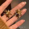 Pendientes Vintage Maillard Ojo de Tigre Fuegos Artificiales para Mujer, Pendientes de Lujo Ligero de Gama Alta Nicho Otoño/Invierno, Nuevo Artículo Caliente 2025
